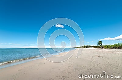 Broad White Sandy Tropical beach Stock Photo