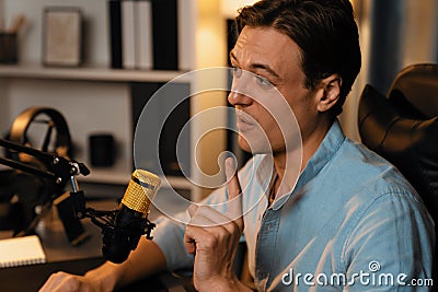 Broadcaster talking on live application searching on laptop. Pecuniary. Stock Photo