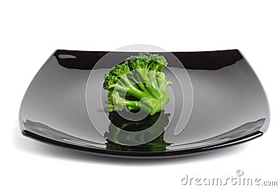 Broccoli on a black dish Stock Photo