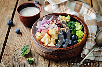 Broccoli blueberry apple salad with greek yogurt poppy seeds dressing Stock Photo