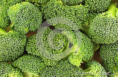 Broccoli florets on cutting board Stock Photo