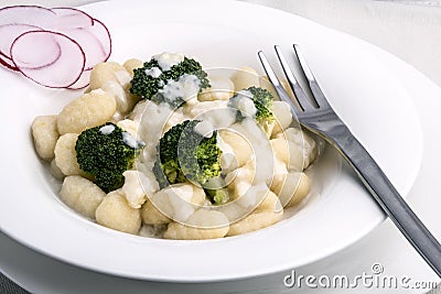 Broccoli gnocchi with cheese sauce Stock Photo