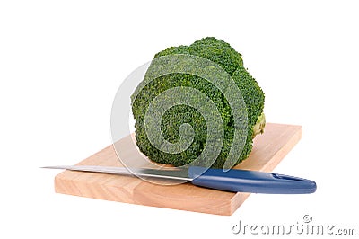 Broccoli with knife on cutting board Stock Photo