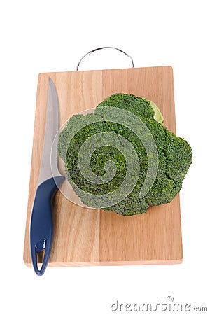 Broccoli with knife on cutting board isolated Stock Photo