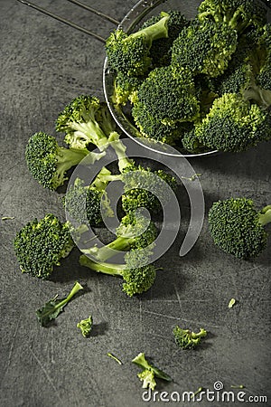 Broccoli pieces on a granite tabletop. Cooking preparation. Stock Photo