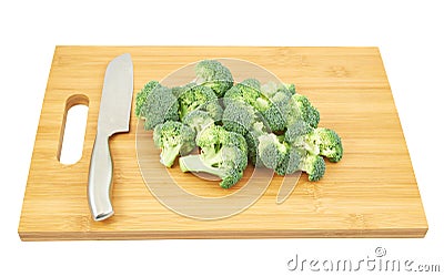 Broccoli pieces over a cutting board Stock Photo