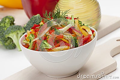 Broccoli, red, yellow and orange sweet pepper salad Stock Photo