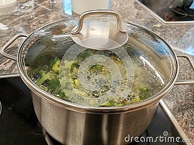 Broccoli soup boiling in a can Stock Photo