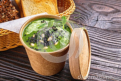 Broccoli spinach cream soup on rustic wooden background Stock Photo