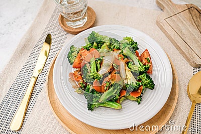 Broccoli and vegetable stir fry. healthy eating and vegan food concepts Stock Photo