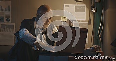 Broke jobless businessman working with his laptop Stock Photo