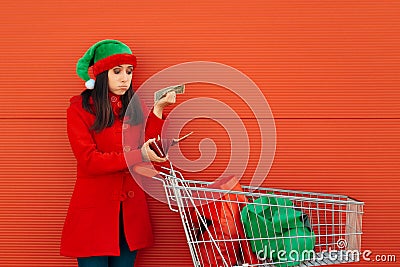 Broke Woman Spending Her Last Dollars on Christmas Shopping Stock Photo