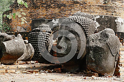 Broken ancient Buddha statue, Ancient buddha broken at Ayutthaya historic park UNESCO World Heritage Site thailand Stock Photo