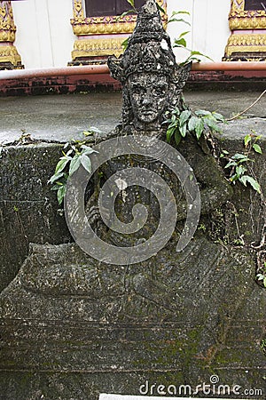 Broken angel sculpture and carving put at outdoor of Wat Khao Or Stock Photo