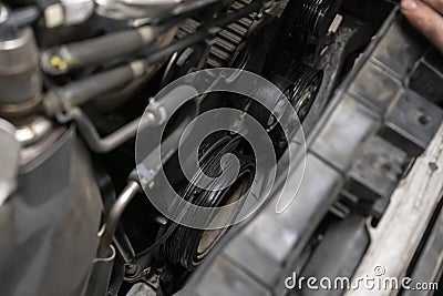 Broken belt in the car engine Stock Photo