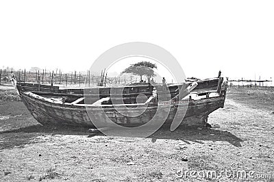 Broken boat near seashore Stock Photo