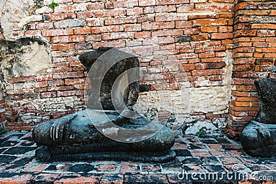 Broken buddha statue, taken outdooor in afternoon Stock Photo