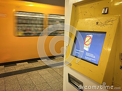 Broken BVG Metro U-Bahn Ticket Vending Machine showing out of order on the display. a train is passing by in the background Editorial Stock Photo