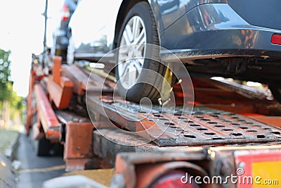 Broken car stands on tow truck closeup Stock Photo