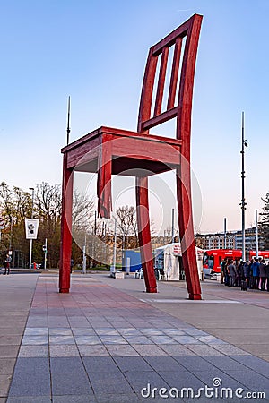 Broken Chair is a monumental sculpture in wood designed by Swiss artist Daniel Berset, Geneva, Switzerland Editorial Stock Photo