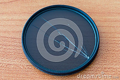 Broken circular polarizing filter. Damaged CPL filter. Stock Photo