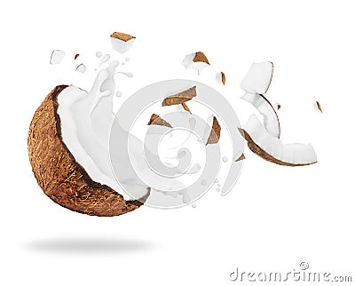 Broken coconut with milk splash, isolated on white background Stock Photo