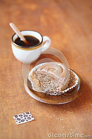 Broken Coffee Cupcake on a wooden plate Stock Photo