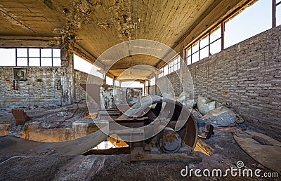 Broken conveyor belt in an abandoned port facility Stock Photo