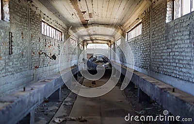 Broken conveyor belt in an abandoned port facility Stock Photo