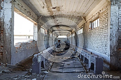 Broken conveyor belt in an abandoned port facility Stock Photo