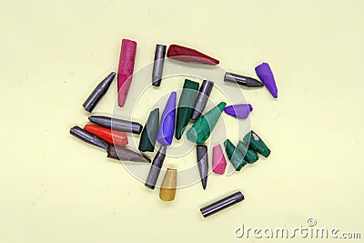 Broken crayon tips. Broken crayons. Crushed crayons. Stock Photo