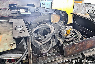 Broken and disassembled cnc machine. Repair of mechanical metalworking equipment Stock Photo