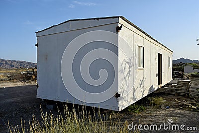 A broken, discarded portacabin. Portable house and office cabins.Porta cabin. Small Portable houses Stock Photo