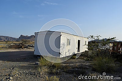 A broken, discarded portacabin. Portable house and office cabins.Porta cabin. Small Portable houses Stock Photo