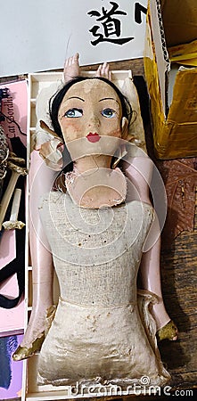 Broken dismantled antique cloth doll Stock Photo