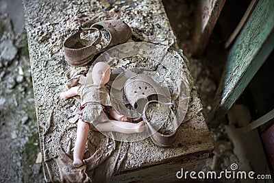 A broken doll in an abandoned kindergarten in Pripyat, Chernobyl exclusion zone. abandoned city, ghost town., Chornobyl Nuclear Stock Photo