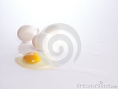 Broken eggs yolks and shells Stock Photo