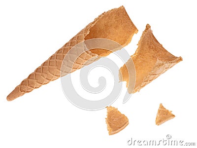 Broken empty sugar ice cream cone in pieces isolated on white background. Stock Photo