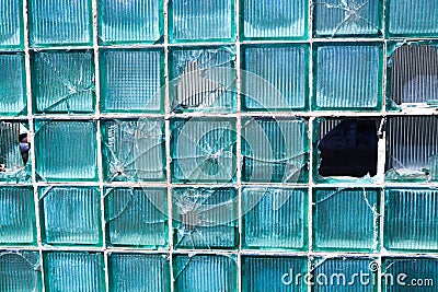 Broken glass for background pattern. Broken window with a bullet hole in the middle Hole in the window. Crash texture Stock Photo