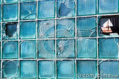 Broken glass for background pattern. Broken window with a bullet hole in the middle Hole in the window. Crash texture Stock Photo