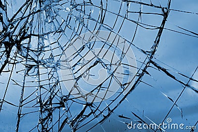 Broken glass. Grid cracks on the glass like cobwebs Stock Photo