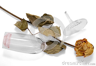 The broken glass and faded rose Stock Photo