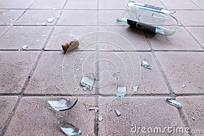 Broken glass on the floor, alcohol abuse Stock Photo