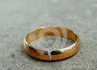 Broken gold wedding band Stock Photo