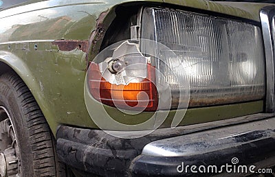 Broken headlight of rusty old car Stock Photo