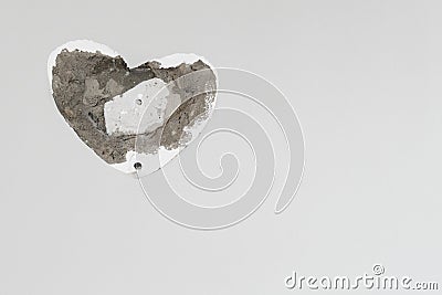 Broken heart. hole in the wall. Stock Photo