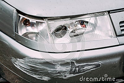 Broken Lamp Headlight And Bumper Car Scratched With Deep Damage Stock Photo