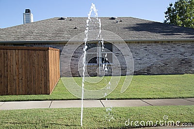 Broken lawn sprinkler Stock Photo