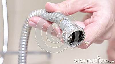 Broken Leaky Shower Hose From A Bathtub Faucet Covered With