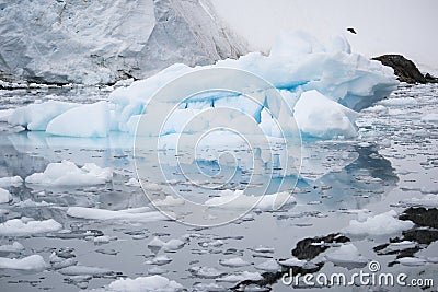 Broken melting pieces of ice at Antarctic peninsula, stunning icy scenery landscape in Antarctica Stock Photo